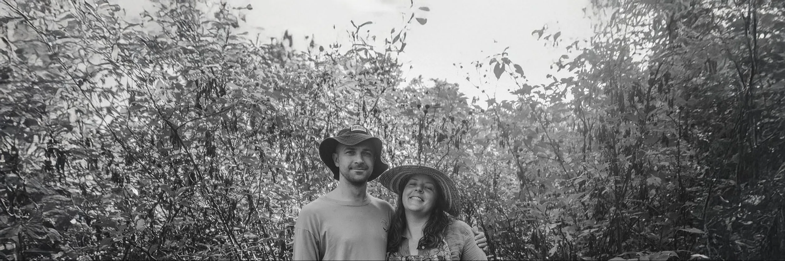 Harriet and partner in tropical forest, black and white